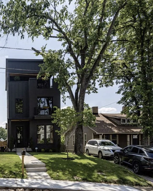 three-story house next to bungalow